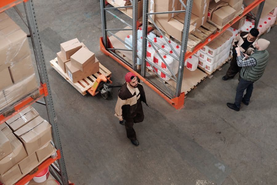 Hands packing a delivery box